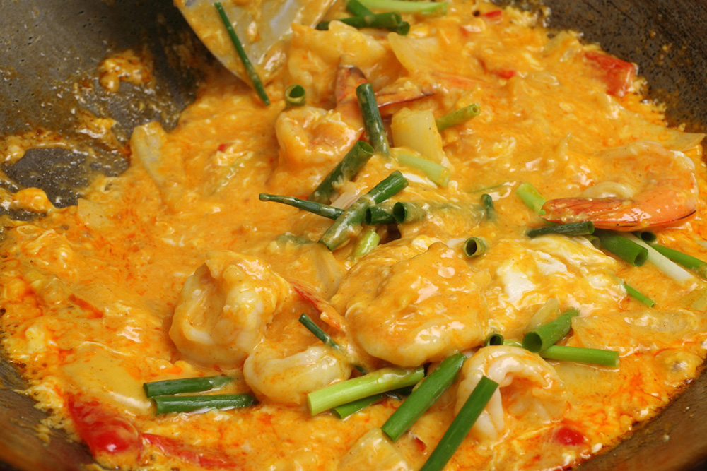 ［９］油を回しかけ、仕上げる